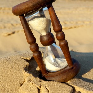 hourglass on sand in desert